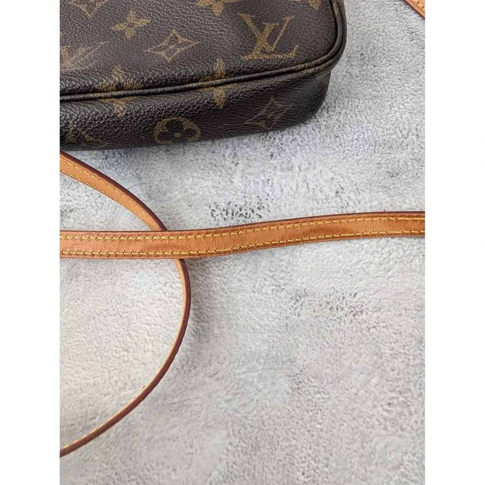 Pochette Accessories with COA crossbody strap and dust bag.